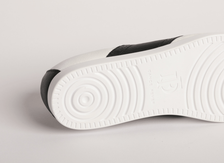 Premium women dance flat in white leather with raised dual pivot point spin spots outsole