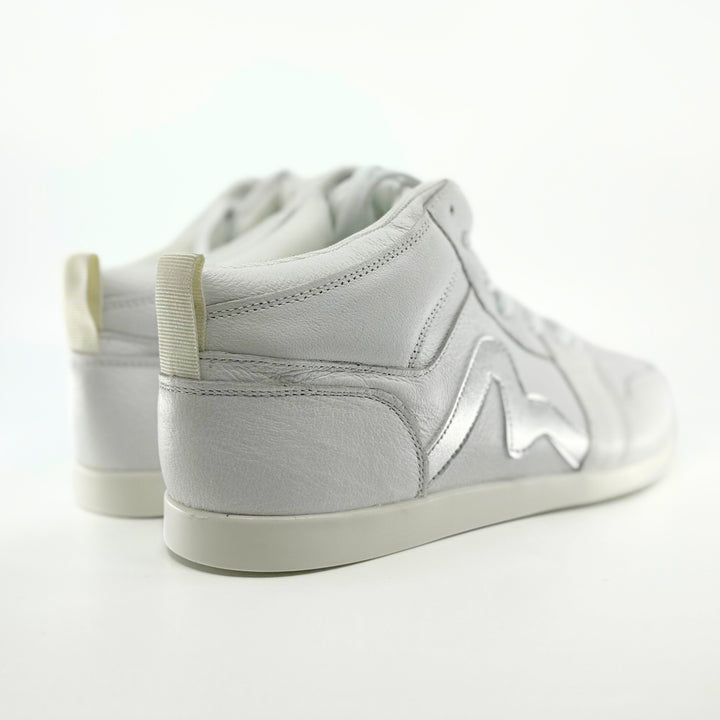 Premium women's high top dance sneaker in white leather featuring raised duo pivot spin spots out sole