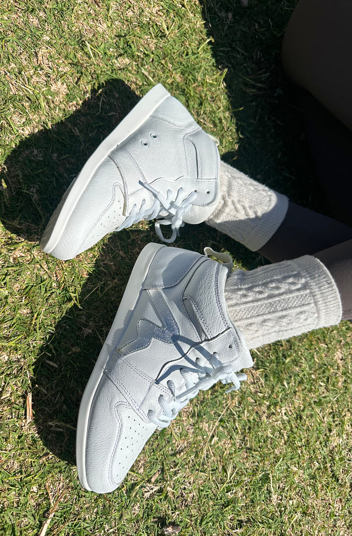 Premium women's high top dance sneaker in white leather featuring raised duo pivot spin spots out sole