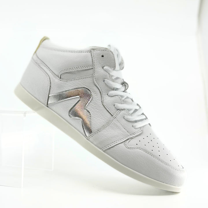 Premium women's high top dance sneaker in white leather featuring raised duo pivot spin spots out sole