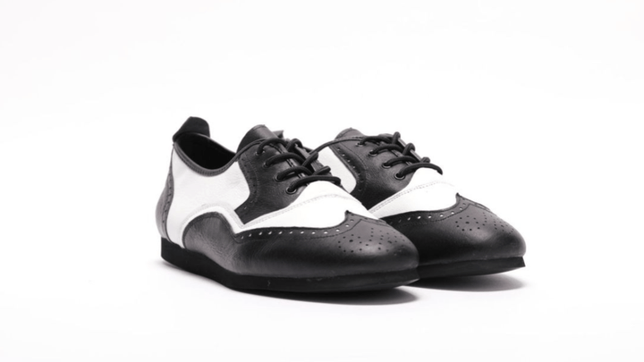 Premium Men's Brogue wingtip dance sneaker in black and white leather with smooth rubber sole