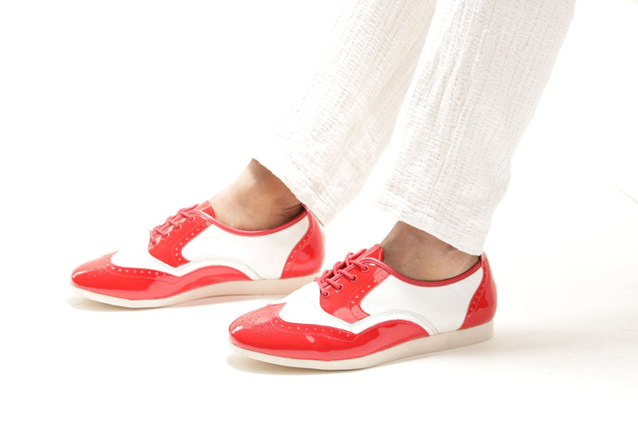 Premium men's rock and roll brogue wingtip dance sneaker in red patent and white leather in smooth rubber sole