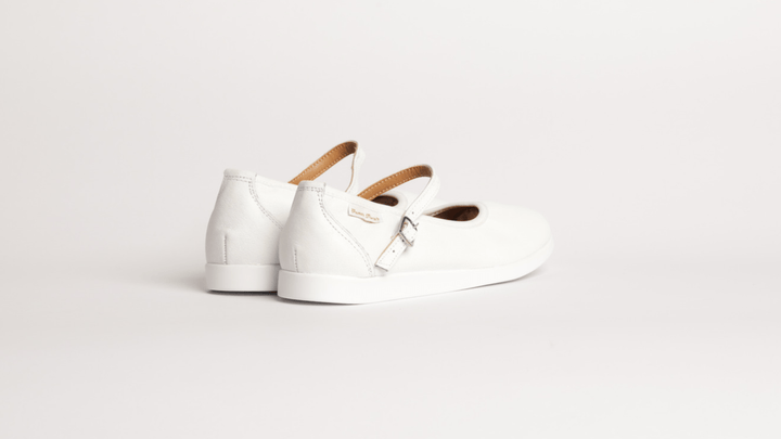 Premium women dance flat in white leather with raised dual pivot point spin spots outsole