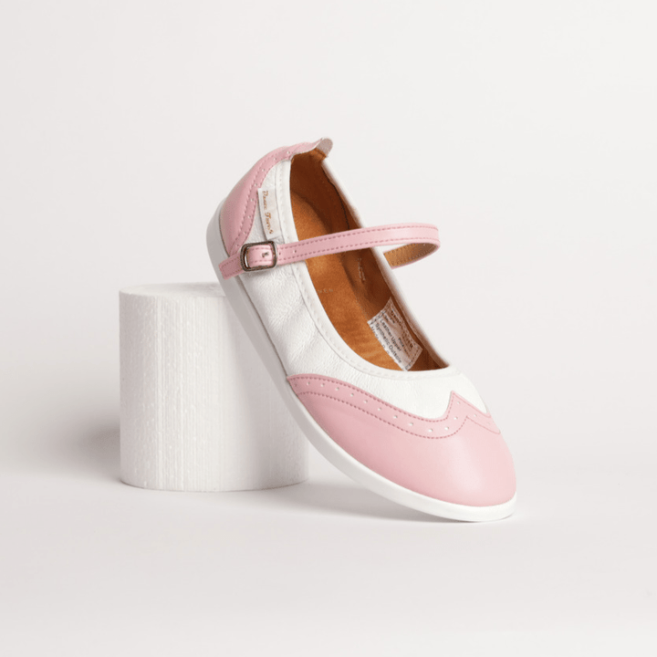 Premium women's rock and roll dance shoes in pink and white leather wingtip design with raised dual spin spots smooth outsole