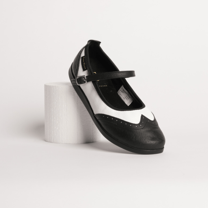 Women's premium Mary Jane rock and roll dance shoes in black and white wingtip leather with raised dual pivot points smooth outsole